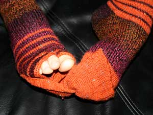 Zehenlose Socken mit Kappe halten auch die Zehen warm.